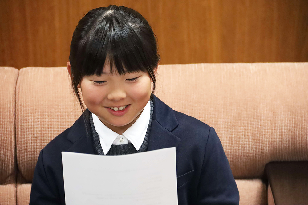報告する津止さんの画像