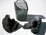 A glass bottle burned and melted during the air raid